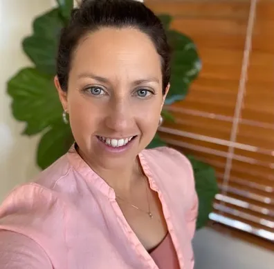 Tara Shekede, Founder of Me Plus More, smiling in a professional headshot.